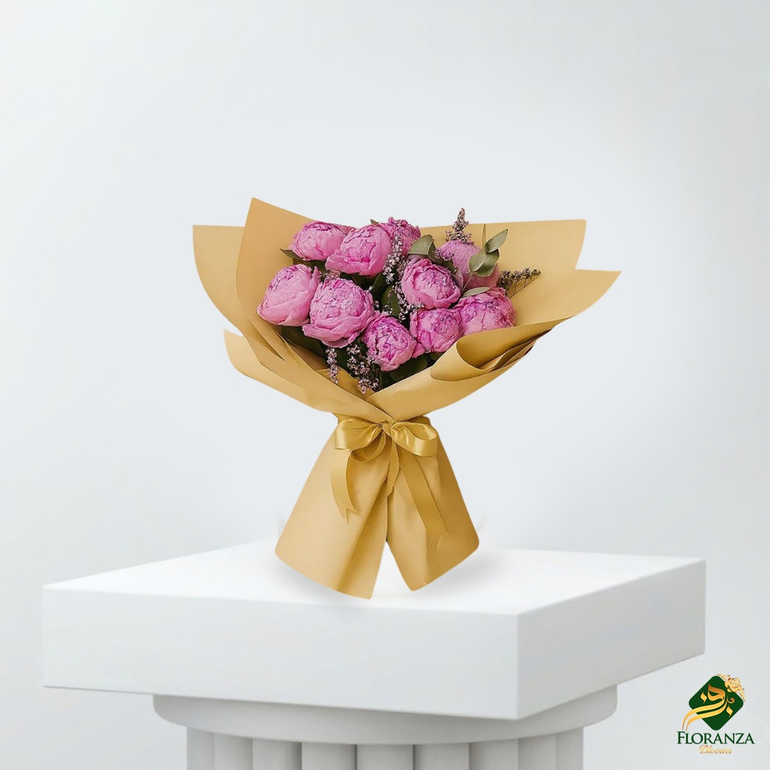 Pink peony bouquet wrapped in yellow paper